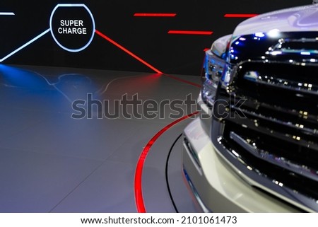 Blurred of car with LED lighting of super charge of place for EV charge for car.