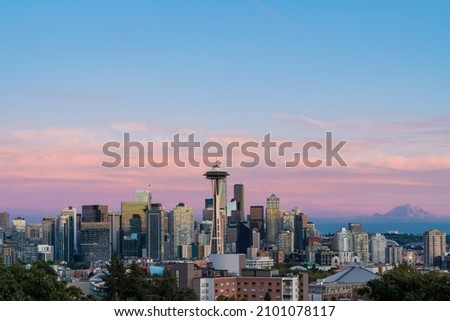 Seattle skyline panorama with iconic view observation tower as seen from Kerry Park. Skyscrapers of financial downtown at sunset, Washington, USA. A vibrant business neighborhood