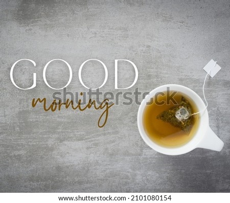 An attractive image cup of tea with teabag and good morning text
