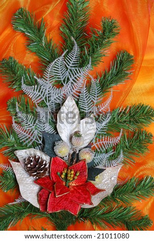 Christmas decoration on golden sateen with  flowers