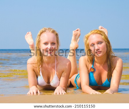 In Bikini Relaxating on a Beach 