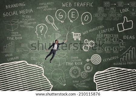 Businesswoman flying with SEO balloon through gap on the blackboard