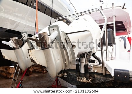 Motor propellers for motor yachts and boats close-up. The motors are installed at the stern of the boat. Boat repair in dry dock. Transportation of boats by cargo ship. Royalty-Free Stock Photo #2101192684