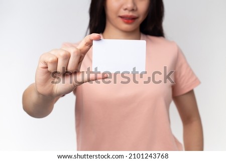 Close up Young Asian woman holding business card isolated on a white background