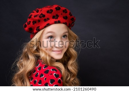 French fashion icon. Happy child wearing french red beret and dress on black background. French little girl look. Little kid in french style. Fashion style. All you need is a change.