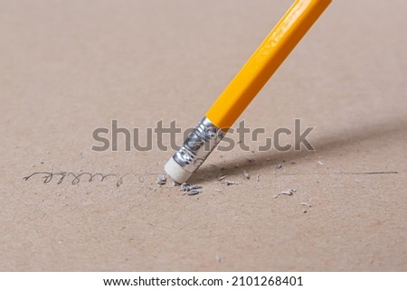 Close up a eraser pencil a straight line and crooked line, Mistake and Unsuccessful concept, Eraser pencil with brow paper Royalty-Free Stock Photo #2101268401