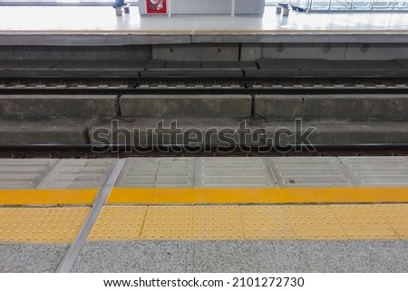 yellow line symbol protects passengers from falling into the electric rail for safety 