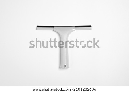 Window glass rubber squeegee, cleaner isolated on white background.High resolution photo.Top view. Mock-up. Royalty-Free Stock Photo #2101282636