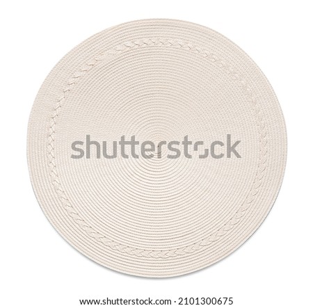 Top view of off-white round woven placemat, isolated Royalty-Free Stock Photo #2101300675