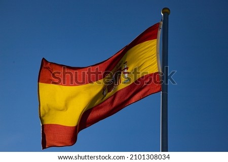 spanish flag on blue background