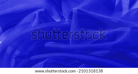 Texture of blue silk fabric. It is also perfect for your design, clothes, posters. Be creative with beautiful project accents. This fabric is inspired by your inspiration.