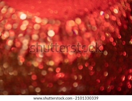 Abstract Red with gold festive background. Bokeh from light . Futuristic glittering in space.