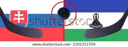 Top view hockey puck with Slovakia vs. Lesotho command with the sticks on the flag. Concept hockey competitions
