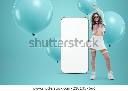 White screen smartphone mockup, environment to showcase mobile app design, creative background, smart phone for your advertisement. A creative girl stands next to a large smartphone. Copy space
