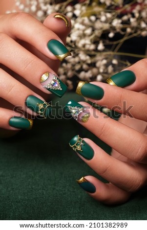 Creative green design of nails on female hands. Art manicure. Royalty-Free Stock Photo #2101382989