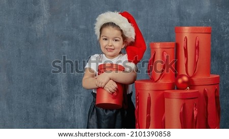 little girl hugs her christmas gift