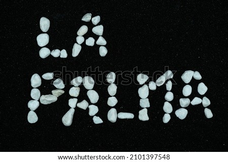 "La Palma" write with white stones over volcanic ash. Canary islands