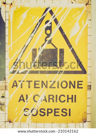 Vintage retro looking A traffic or a construction site sign - Beware suspended loads