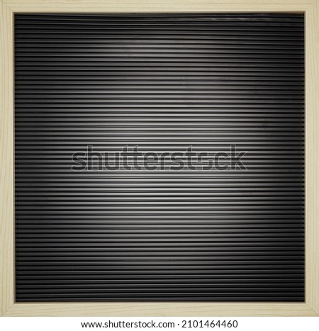 A studio photo of a black letter board