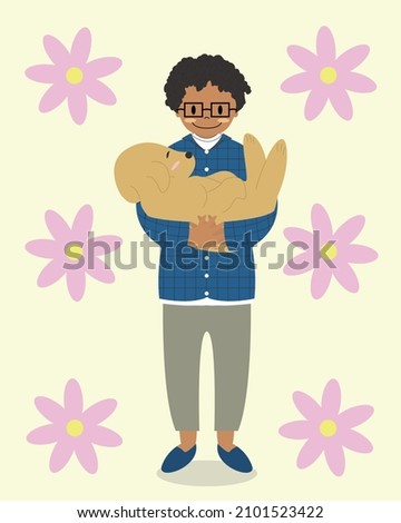 A boy holding a lovely dog.