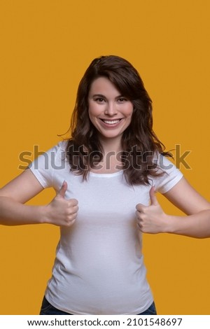 Smiling cute girl showing a sign of approval