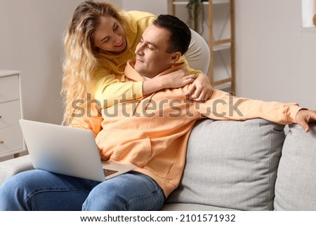 Happy couple spending time together at home