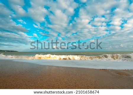 White clouds in the blue sky over tropical beach