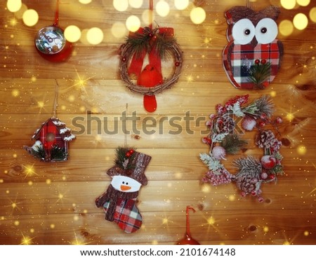 winter christmas background with decor on fir branches cones and snow on blue wooden texture                              