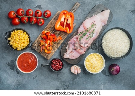 Mexican food ingredients Chicken Enchilada, Rice Casserole, on gray background, top view flat lay