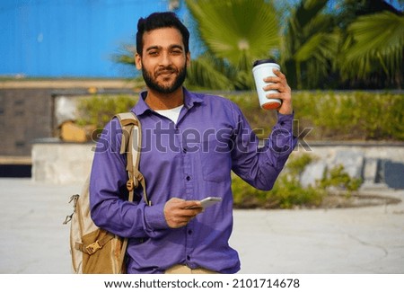 Handsome Indian Young Collage student with book closeup stock photo