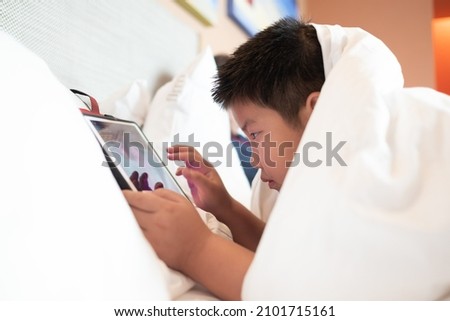 kid watching tablet, boy addicted cartoon
