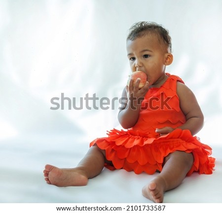 10 month old baby biting into apple