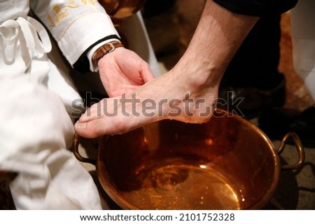 Maundy thursday celebration. Washing of the Feet. Roman Catholic church.  France.  Royalty-Free Stock Photo #2101752328