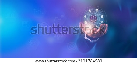 Close up of Labor law in businessman hand, Lawyer, Attorney at Law, Legal advice business concept on screen. Royalty-Free Stock Photo #2101764589