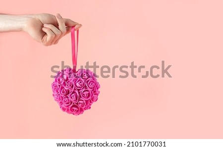 Happy Valentine's Day. Valentine's day background design. Valentine background. Valentine's Day. Man's hand holding a heart of roses. Banner. Copy space