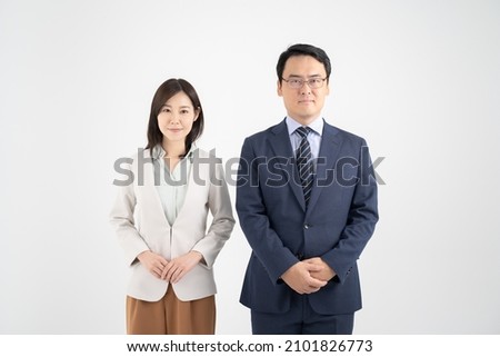 Male and female businessmen with hands in front White background