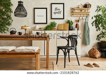 Stylish composition of cozy kitchen interior design with mock up poster frames, beige commode, wooden table, chair and bench and kitchen accessories. Template.

