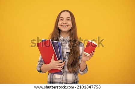 knowledge day. kid in checkered shirt with notebook and tea cup on yellow background.