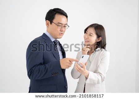 Male and female businessmen talking via smartphone White background