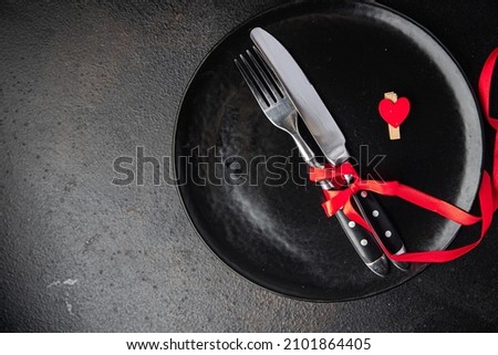 valentine's day table setting cutlery fork, knife, plate holiday decoration love date copy space food background