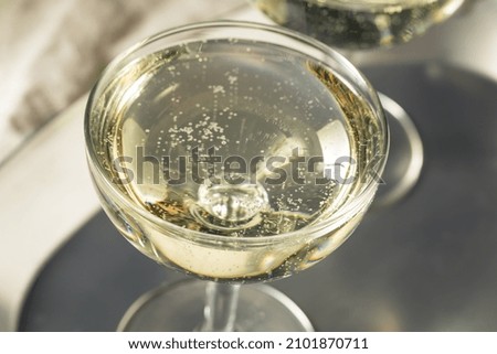 Cold Refreshing Bubbly Champagne in a Coupe Glass for New Years Royalty-Free Stock Photo #2101870711