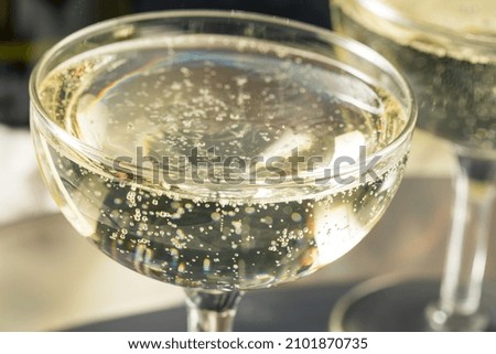 Cold Refreshing Bubbly Champagne in a Coupe Glass for New Years Royalty-Free Stock Photo #2101870735
