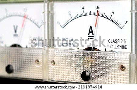 Arrow of the analog DC ampmeter shows the value of .6 amp.                                 Royalty-Free Stock Photo #2101874914