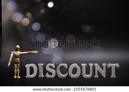 text discount on a dark background with bokeh . Royalty-Free Stock Photo #2101876801