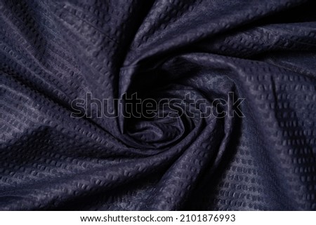 close up texture blue fabric of suit, photo shoot by depth of field for object Royalty-Free Stock Photo #2101876993