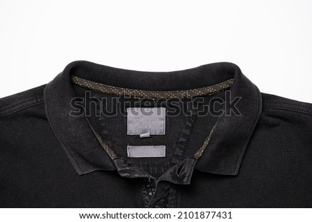 Black shirt collar with button. High quality photo Royalty-Free Stock Photo #2101877431