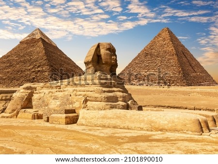 The Great Sphinx between the Khafre and Menkaure Pyramids of Giza, Cairo, Egypt Royalty-Free Stock Photo #2101890010