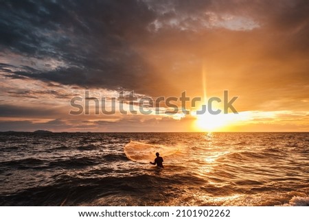 Fisherman fishing in the sea
