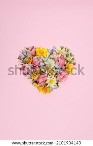 Floral heart on a pink background