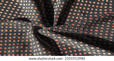  black silk fabric with red polka dots. Light and silky-soft satin charm is ideal for your design, Internet projects. Texture background, pattern, 